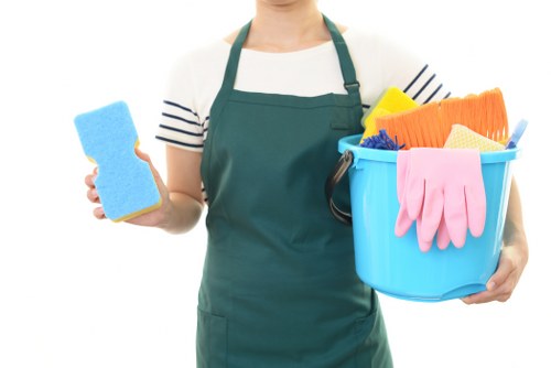Local cleaning team working in a Fulham building corridor and lobby
