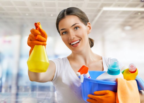 Cleaner wearing protective gloves while preparing safe cleaning products